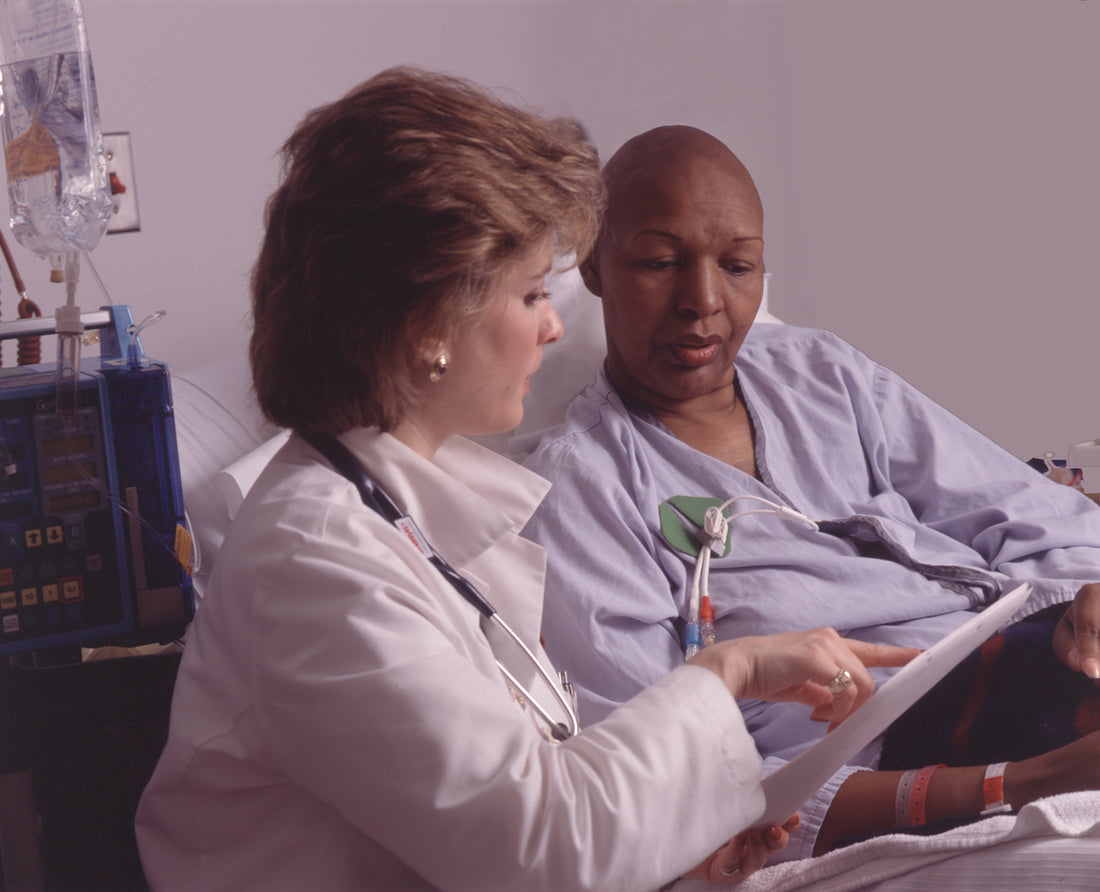 Health professional consulting with a patient